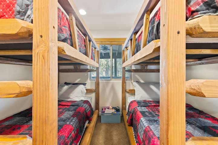 Bunk room with a box of toys for the kids to play with