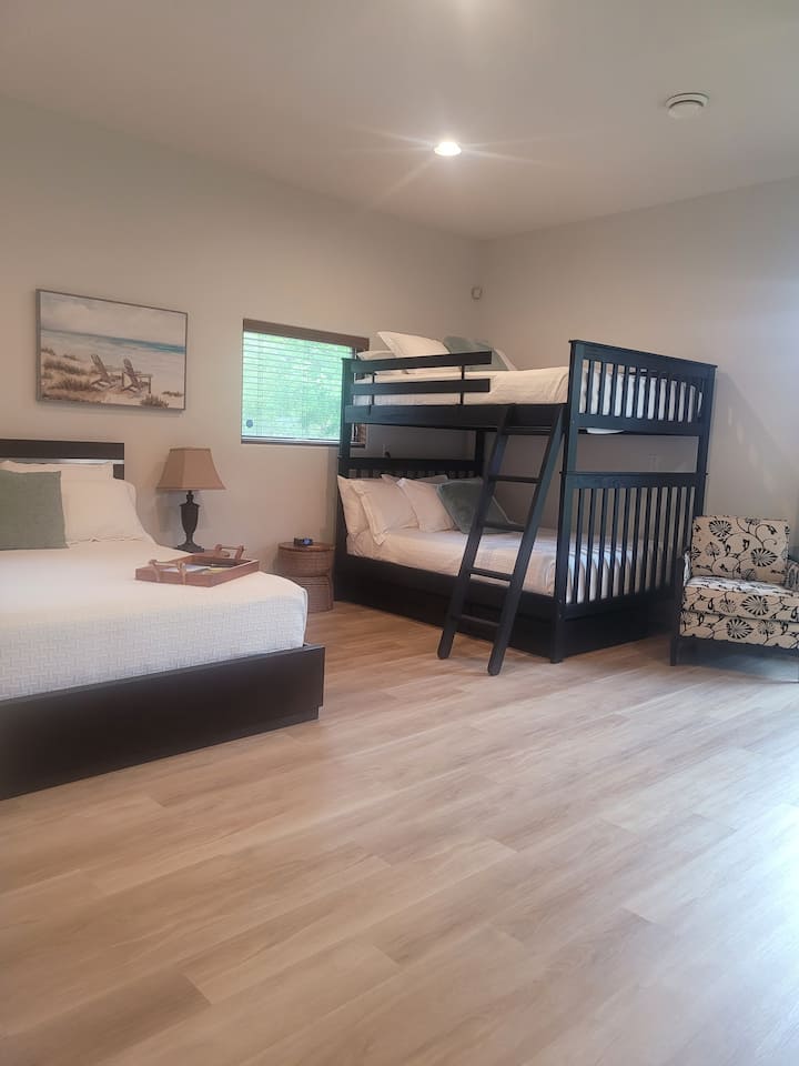 guest bedroom with queen bed plus queen size bunk beds adult size and ensuite