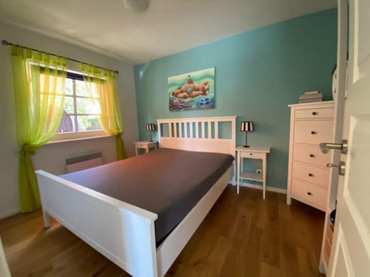 The ground floor bedroom with window to the terrace