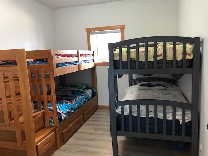 kids, kids & more kids.... 
workable for adults!
space in the staircase & under one bunk gives a spot to stash your stuff!!
A desk next to the plugin with USB ports makes tech accessible.
Bedrooms have a keypad lock can have personal code for access.