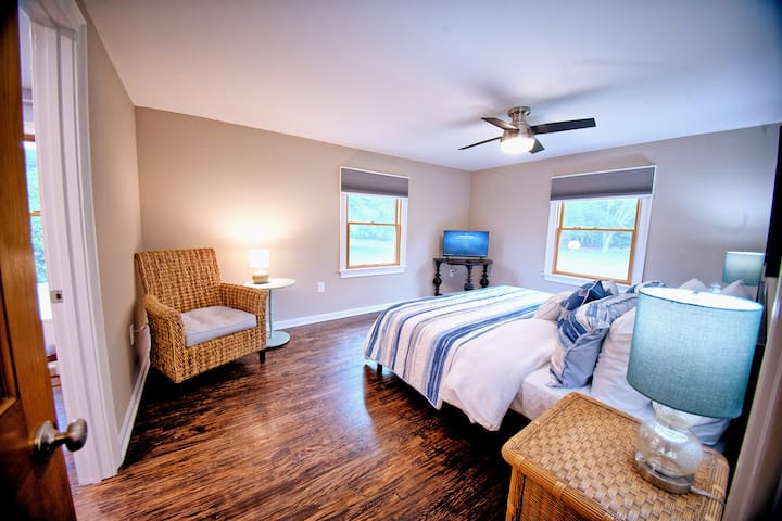 Lay back and watch some TV in the Master Bedroom before calling it a night in the King-Sized Bed 