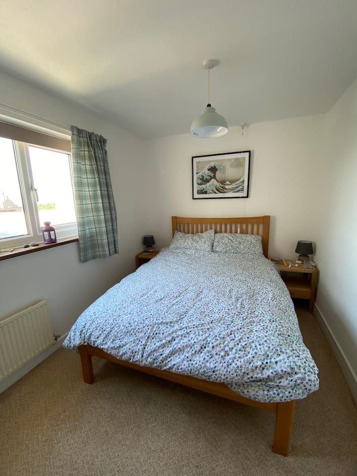 slaapkamer op de begane grond 1 met tweepersoonsbed