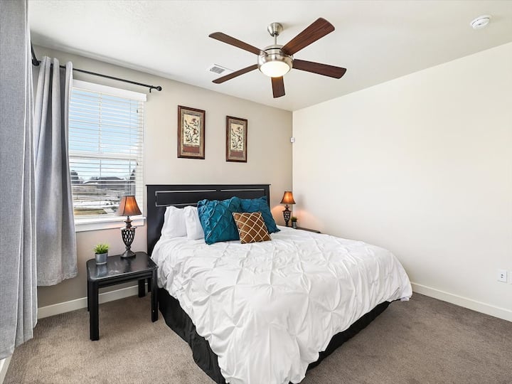 Large bedroom with King size bed, side tables, Ceiling fan and a closet for cloth storage.  Very comfortable.