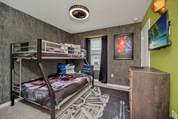 Star Wars room featuring twin over full bunk bed.
