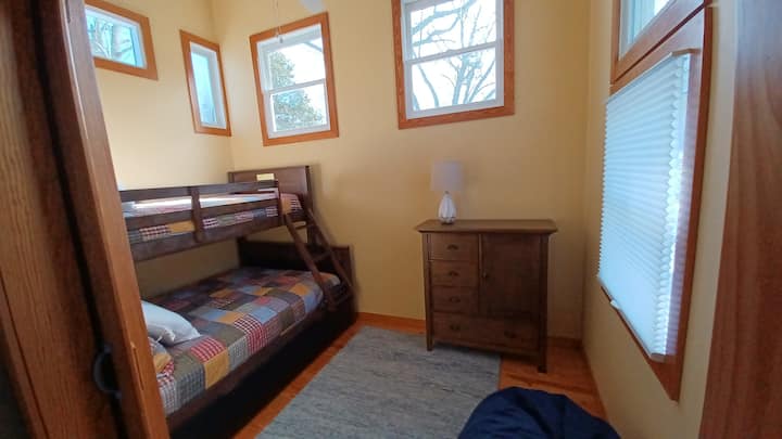 The second bedroom, which is off the master, has solid bunks with a twin on top and a double below, and a bean bag to collapse into after a wonderful day on the farm.