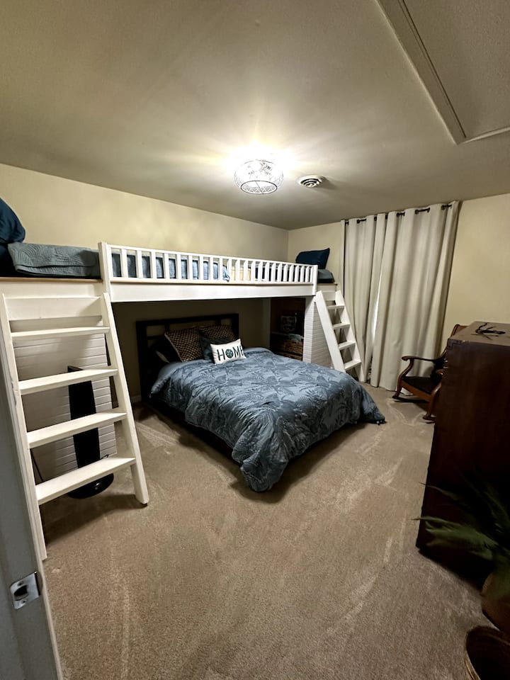 Turquoise tranquility awaits you in Bedroom 2! Unpack your vacation wardrobe in the spacious closet. With space for four, a rocking chair for daydreams, and a smart TV for movie nights, this room is your personal coastal retreat. ️
