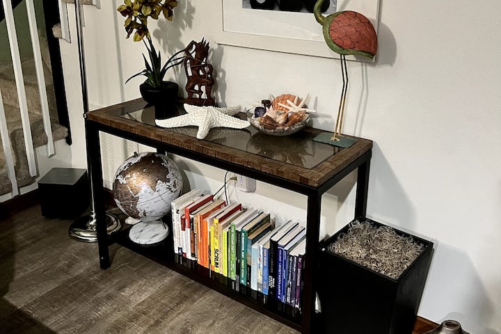 Rainbow Reading Retreat!  Our living room library nook is a colorful escape – grab a book, leave a book. It's a reading adventure with a coastal twist. 
