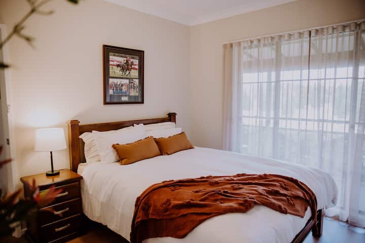 Bedroom 2 has a super-comfortable queen bed and lovely windows to let in the natural light.