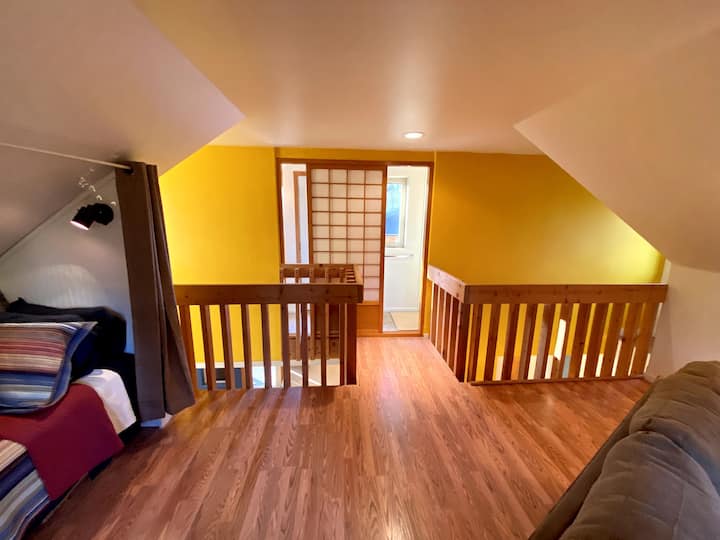 The full bath in the lofted area has Japanese pocket doors, and access to a large upper patio.
