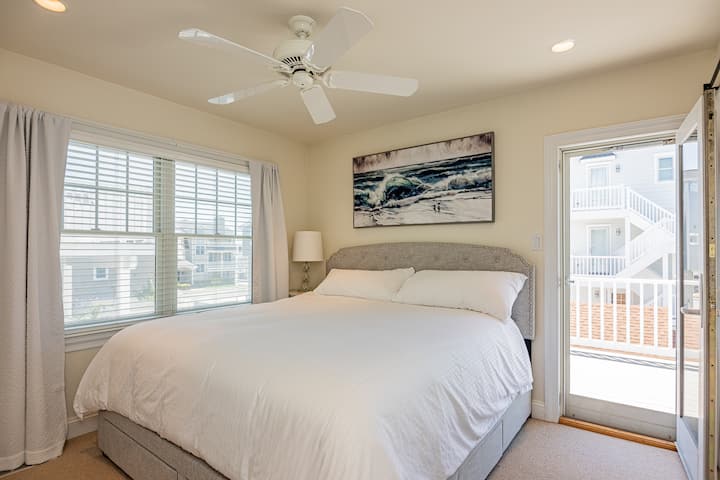 Mid-level King bedroom with an en-suite full bath and a private back deck