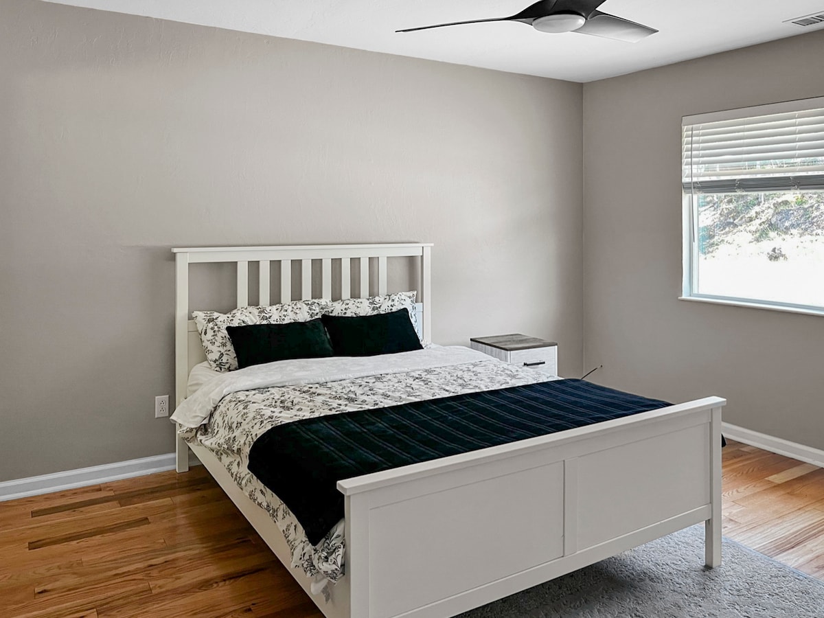 The secondary upstairs bedroom has plenty of closet space with hangers. It also has a bathroom next door, which is stocked with towels and shower amenities