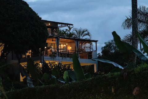 Country home on coffee farm with charming cabins.