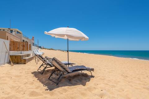 Two beachfront semi detached villas on the sand
