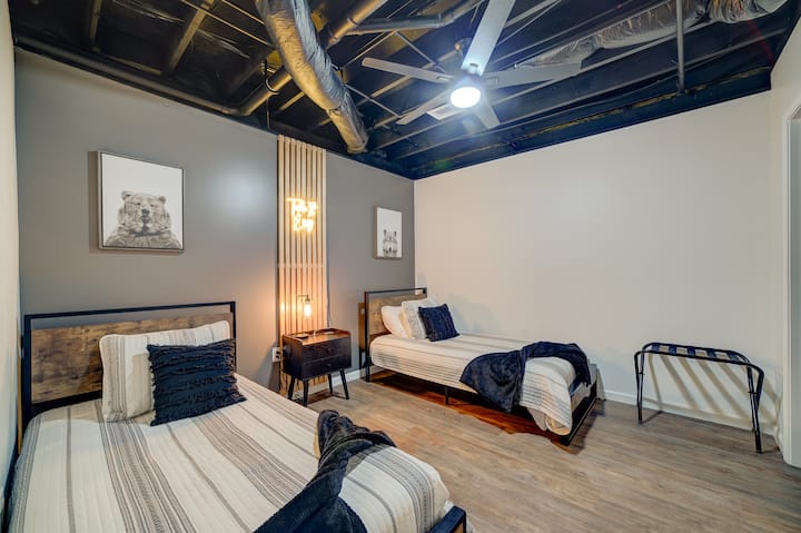 Bedroom on the lower level. Designed with tweens in mind (we have a few in our extended family), this room has two twin beds, luggage racks, shared nightstand, and its own bathroom. Now you don't have to share the space getting ready!