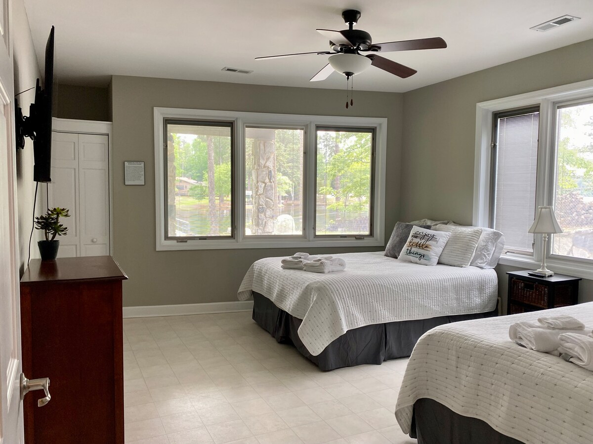 Bedroom #4 (lower level) boasts two Queen sized beds and a smart tv