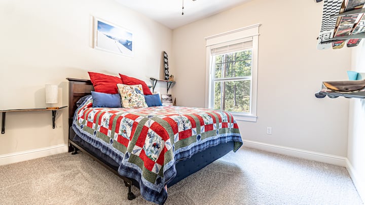 Bedroom 3 with queen mattress and unique ski decor.