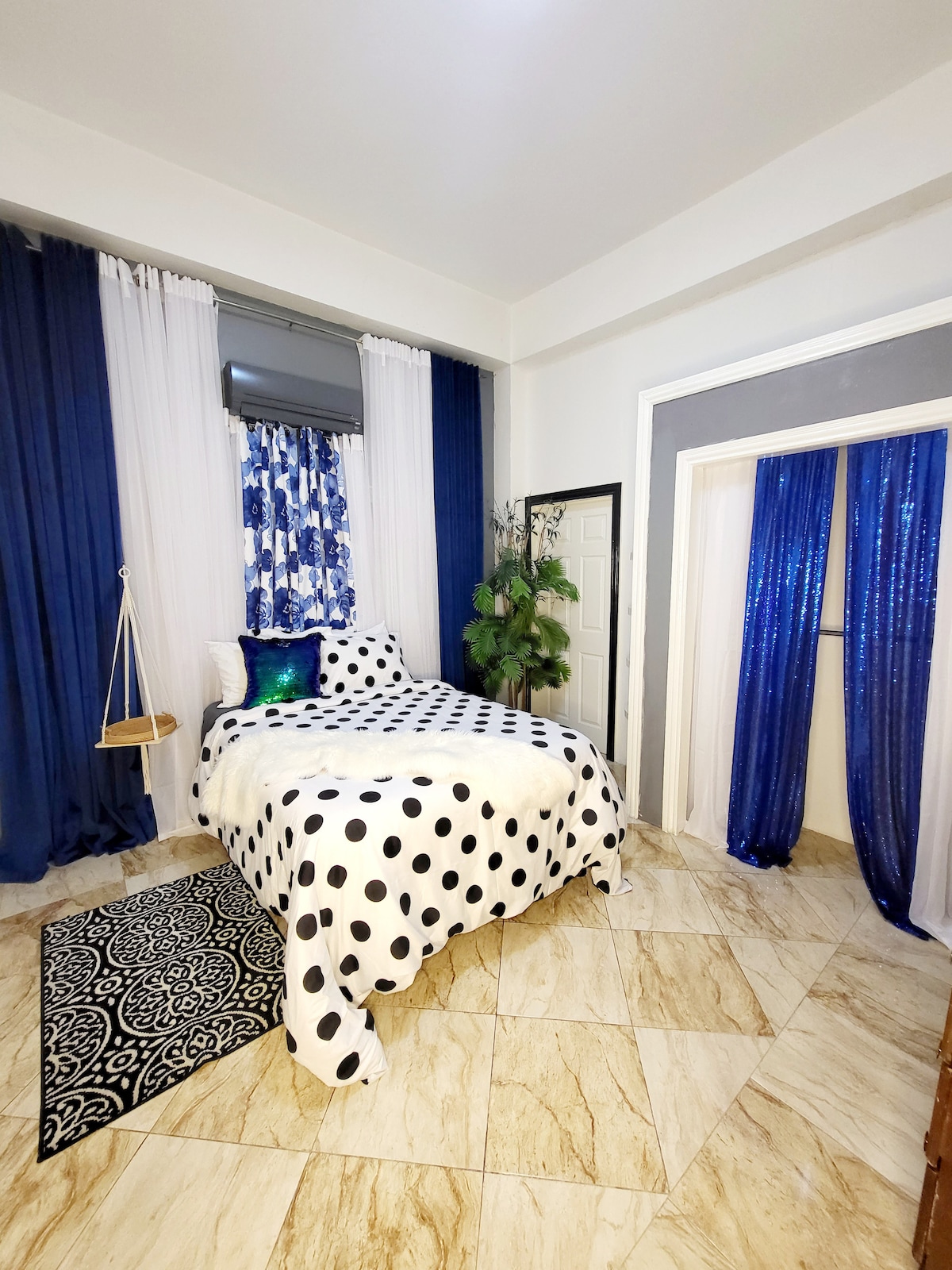 One of my favorite rooms. Double room with sequin drapes and AC. Ideal for him and her. 