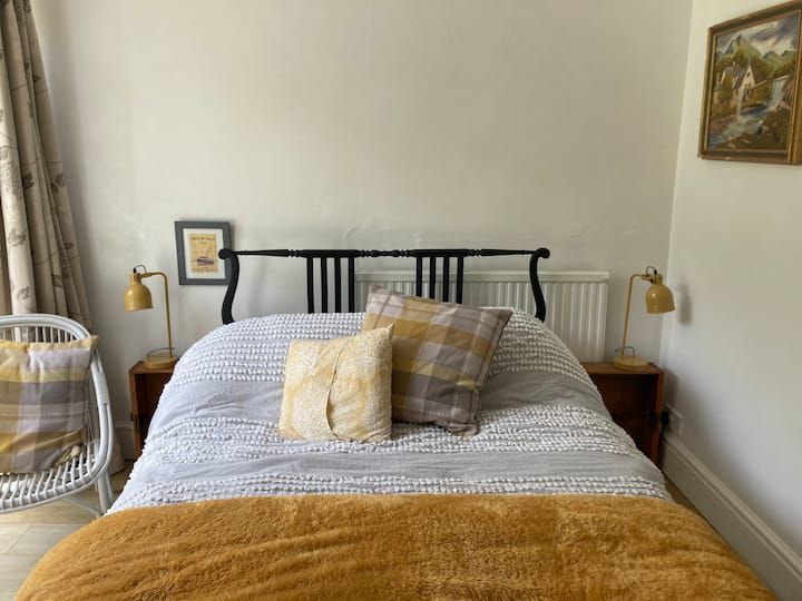 Bedroom with double bed and door out to garden
