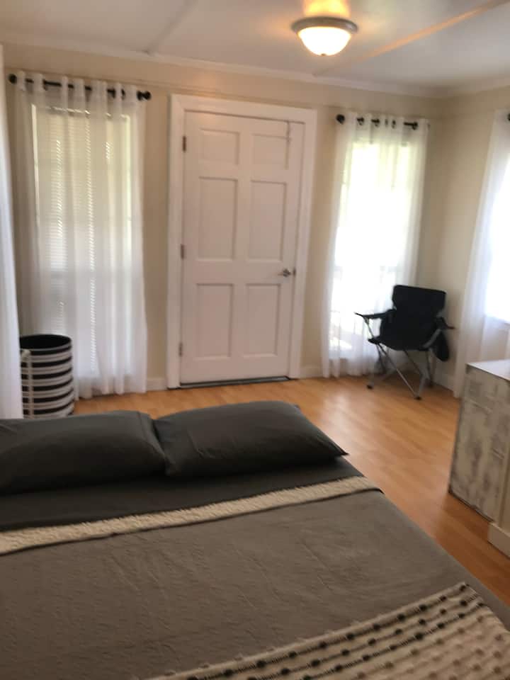 This is the Front entrance / froyer which includes a small homemade clothes hanging closet and cubby whole for luggage.