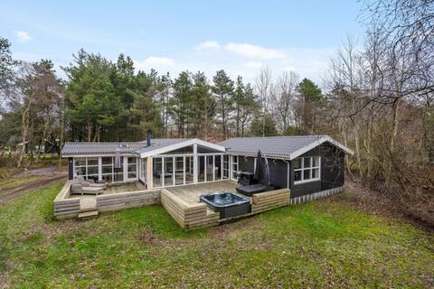 Undisturbed holiday home with outdoor spa and activity room