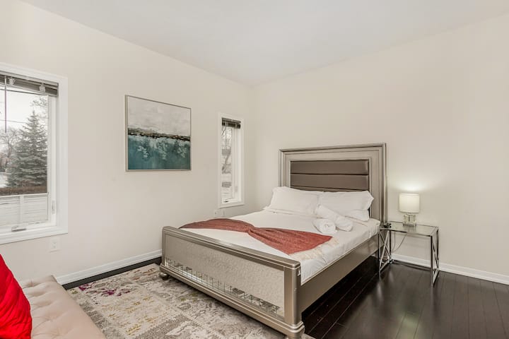 Ground floor bedroom. King bed next to a full bath