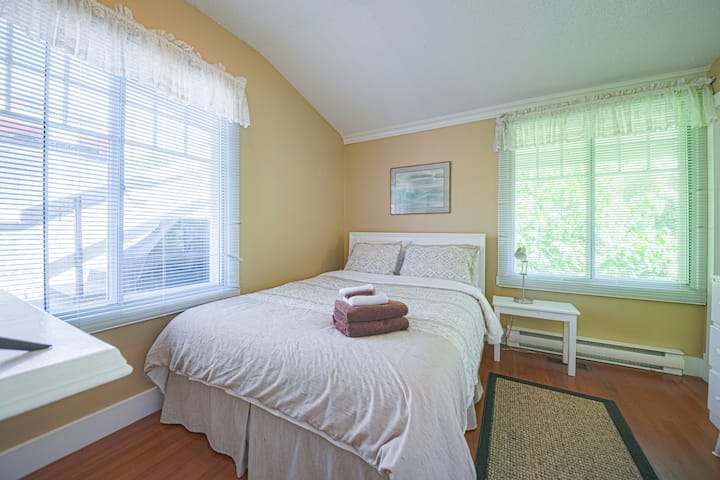 Upstairs suite's main bedroom with ensuite