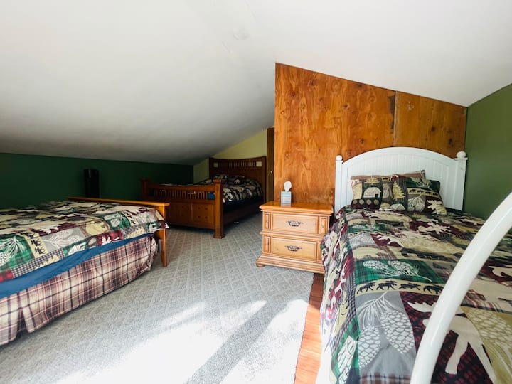 Second floor. 
Two Queen, One twin bed 
Full bathroom