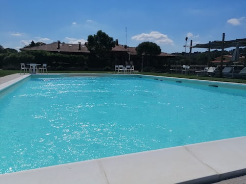 Villa surrounded by greenery with pool, tennis and soccer