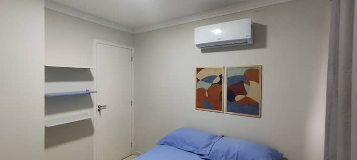 Suite with double box bed, blackout curtain and air-conditioning.