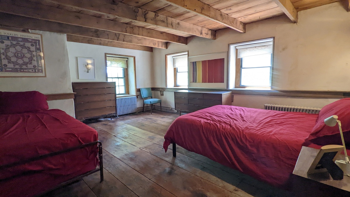 Bedroom #4  is also quite spacious with a queen-size bed, a twin trundle bed, two dressers, and nightstands. This is a great room for a family with younger children or a great place for a kids' bedroom. 