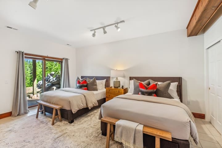 Final 3rd bedroom in this home.  Located on the lower level and down the hall from the other king bedroom.  Features 2 queen beds and sliding glass doors that lead to the fire pit and offer amazing mtn views.