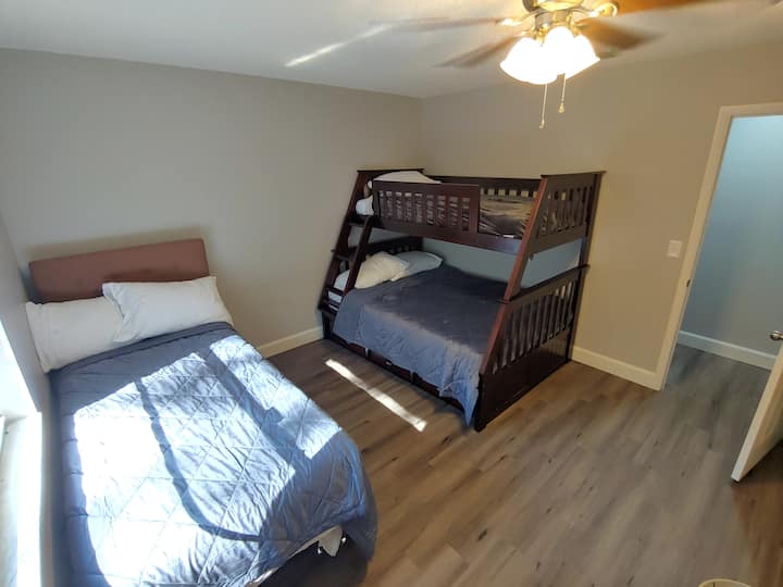 Guest Bedroom 2 with a TwinXL "Cloud mattress", and bunk beds with a 1-full and 1-twin mattress and a 50" TV