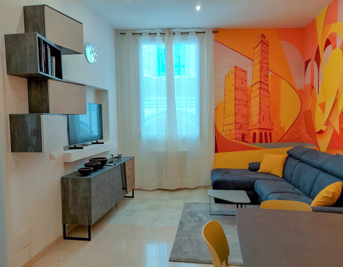 Sebule iliyo na televisheni ya 50"na ukuta ulio na vifaa vya vitabu. 
Kitanda maradufu cha sofa kilicho na godoro la juu kwa starehe ya kiwango cha juu