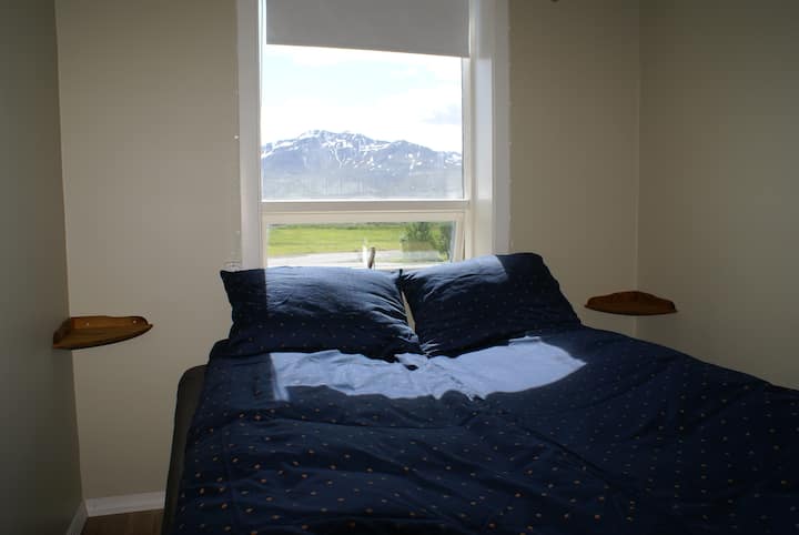 The bedroom has a queen-size bed with my foam mattress and headboard that's not available in the store.