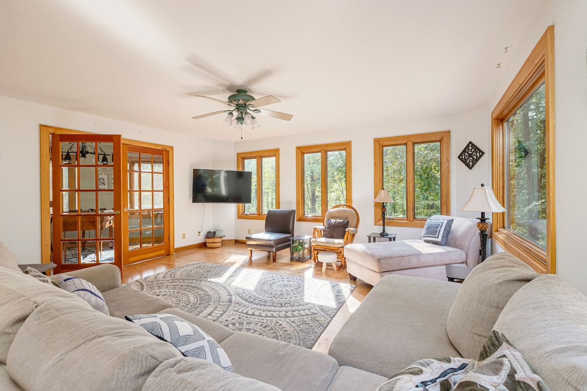 Living room.  Sectional couch, Chaise Lounge, three sitting chairs. Roku TV (login with your account). Connected Game room. 