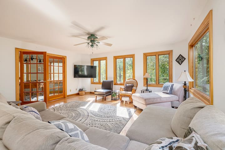 Living room.  Sectional couch, Chaise Lounge, three sitting chairs. Roku TV (login with your account). Connected Game room. 