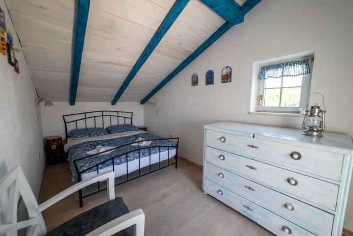 The exit from this bedroom is to the loggia with a beautiful view of Mount Učka.