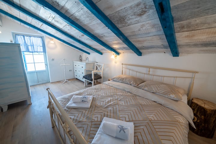 The exit from this bedroom is to the loggia with a beautiful view of Mount Učka.