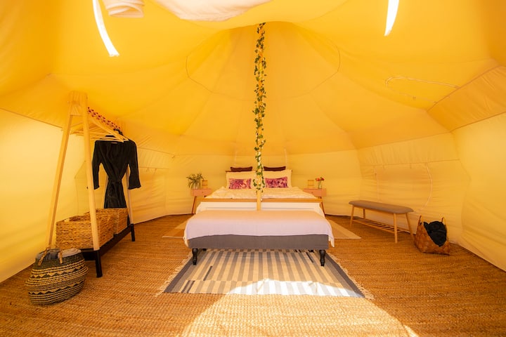 The large interior of this tent allows us to provide you with a king size bed and storage furniture