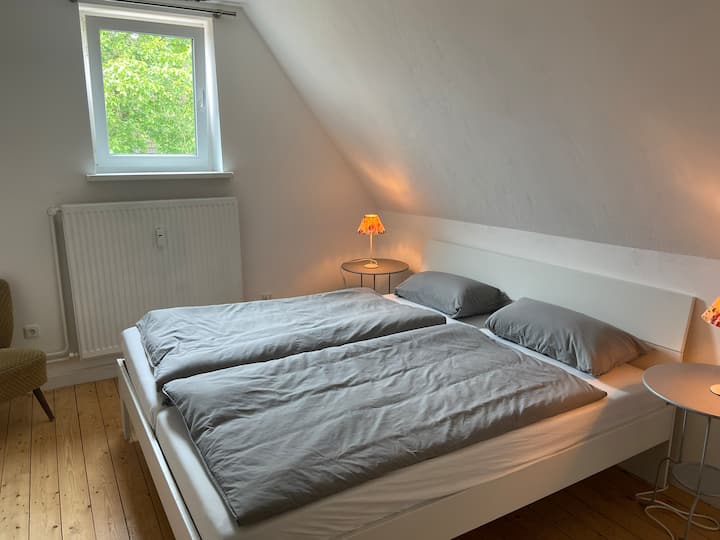 Upper bedroom (right) with double bed