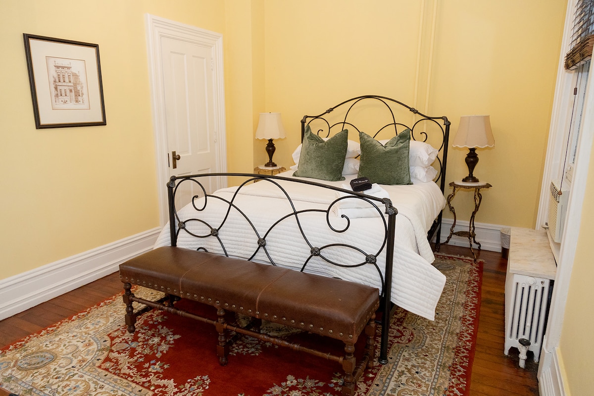 Main floor bedroom with adjoining sitting room and bathroom.