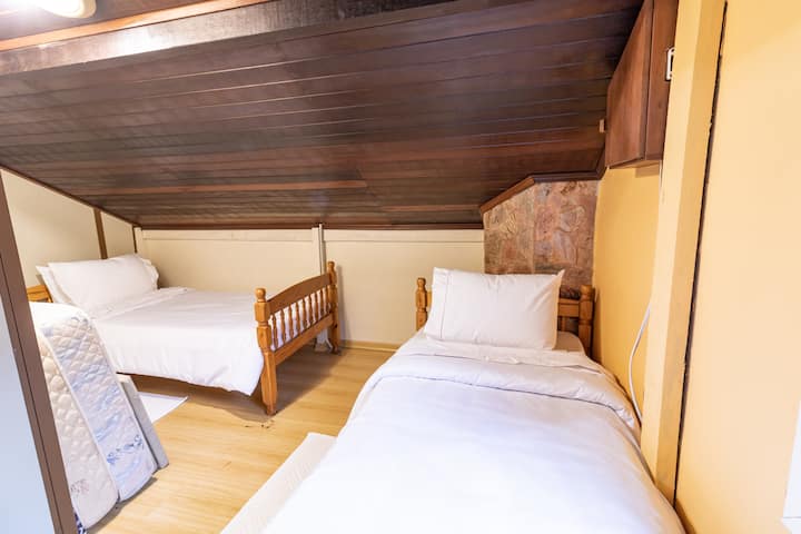 Two single beds and extra mattresses.