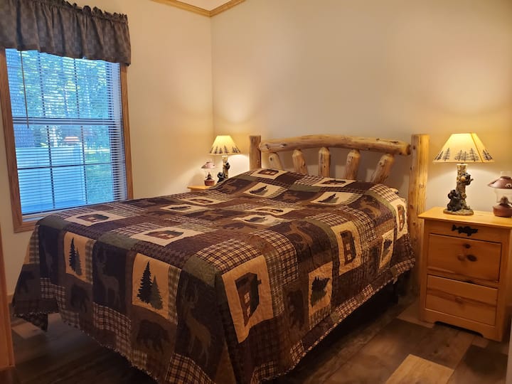 Main Level bedroom- queen bed, two nightstands with two draws each, lamps, small fan, extra plug-ins with USB ports, and a full closet for plenty of storage.
