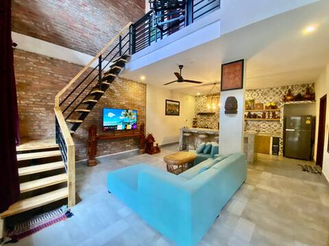 Modern 2-bedroom townhouse with rooftop terrace.