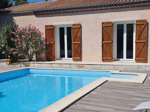 Nice house with pool, garden, and garage.