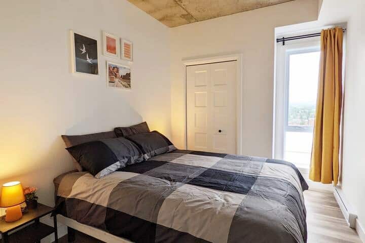 Bedroom with a queen-sized bed and a wardrobe