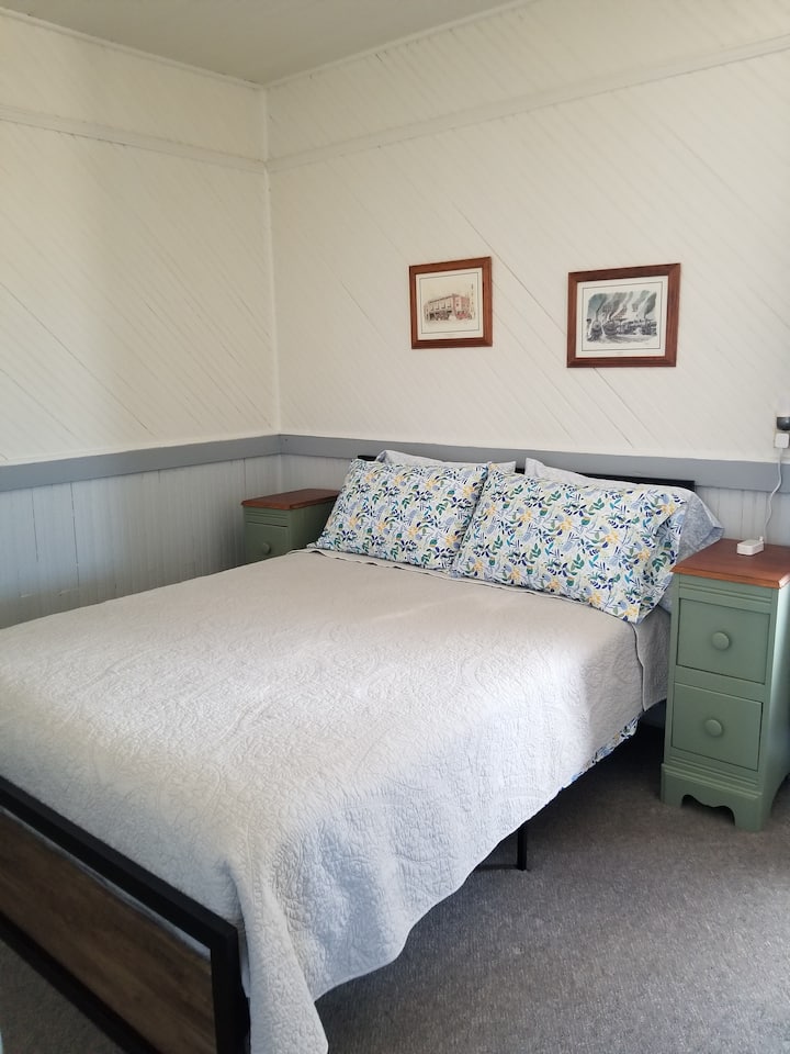 The main bedroom has a queen bed.
