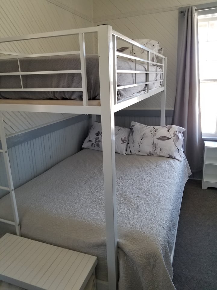 Additional sleeping area has a full on bottom and a twin on top