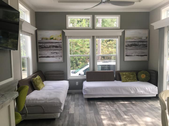 Two Twin XL beds in LR.  Extra Linens and Towels in the cabinet next to Microwave.