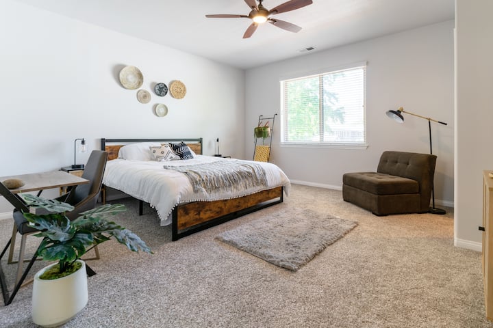 View of our second bedroom. Queen-sized bed with lots of natural lighting and very spacious closet space. Perfect for couples!